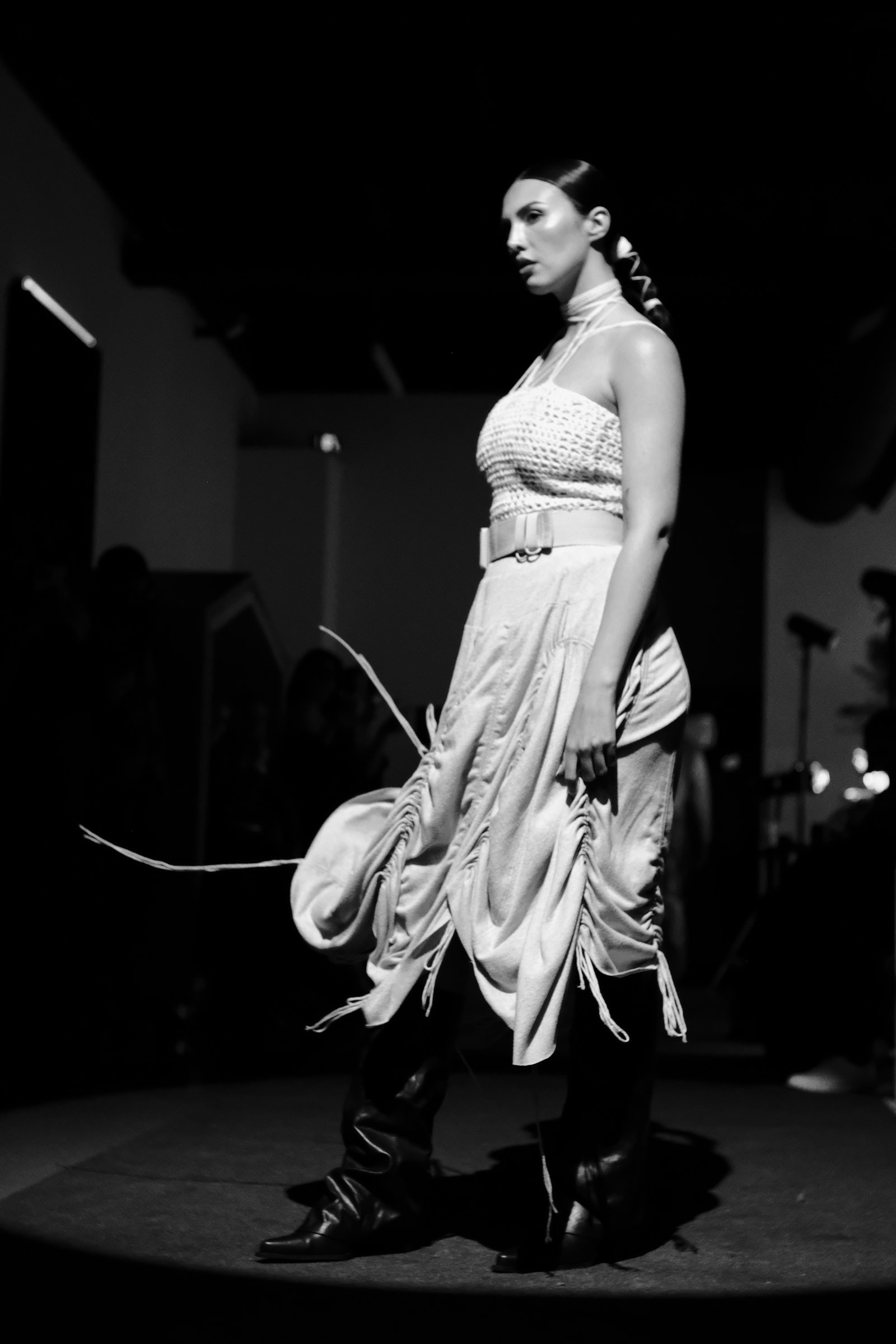 Runway model in a draped metallic dress