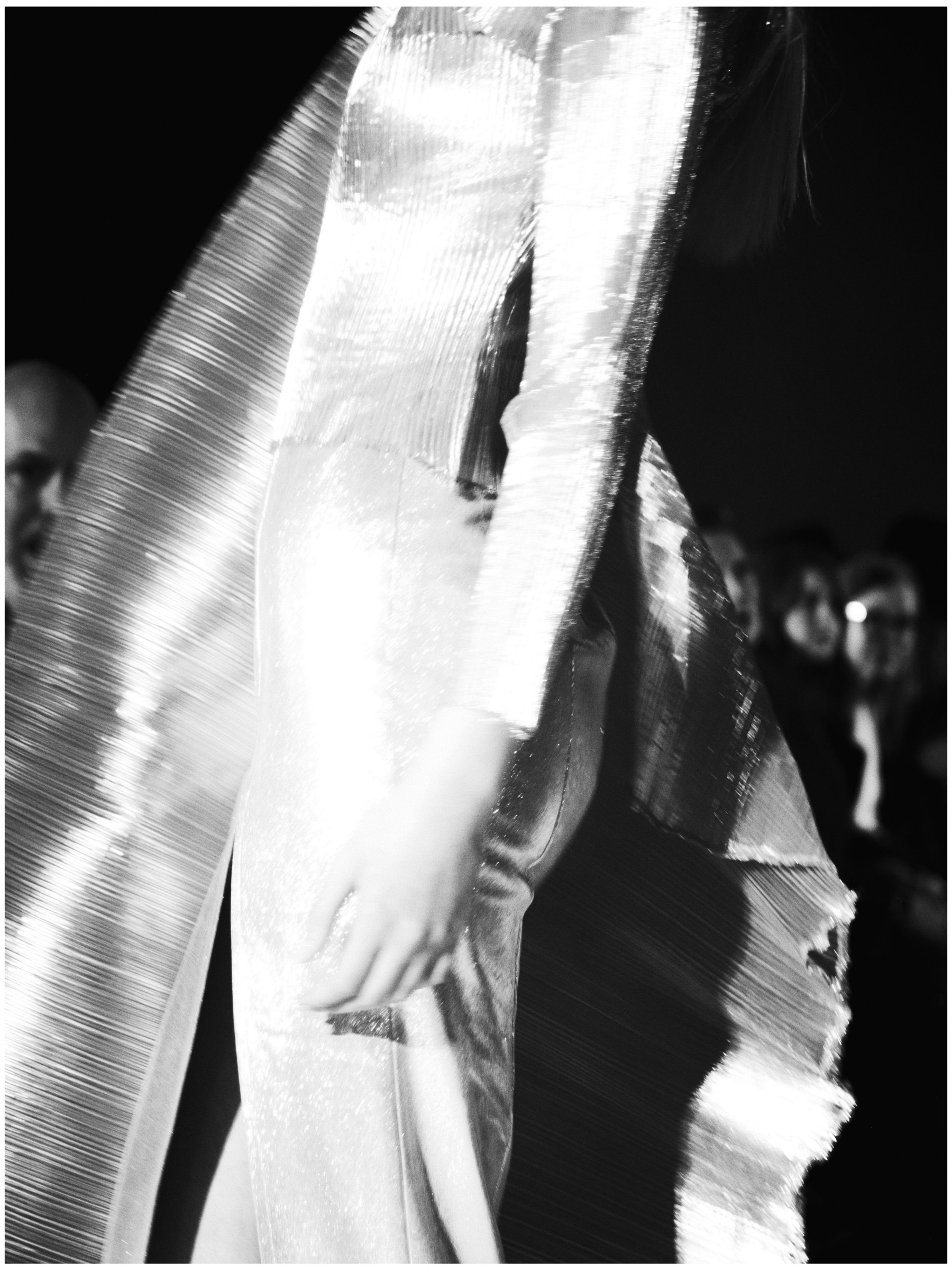Close runway detail of pleated metallic fabric