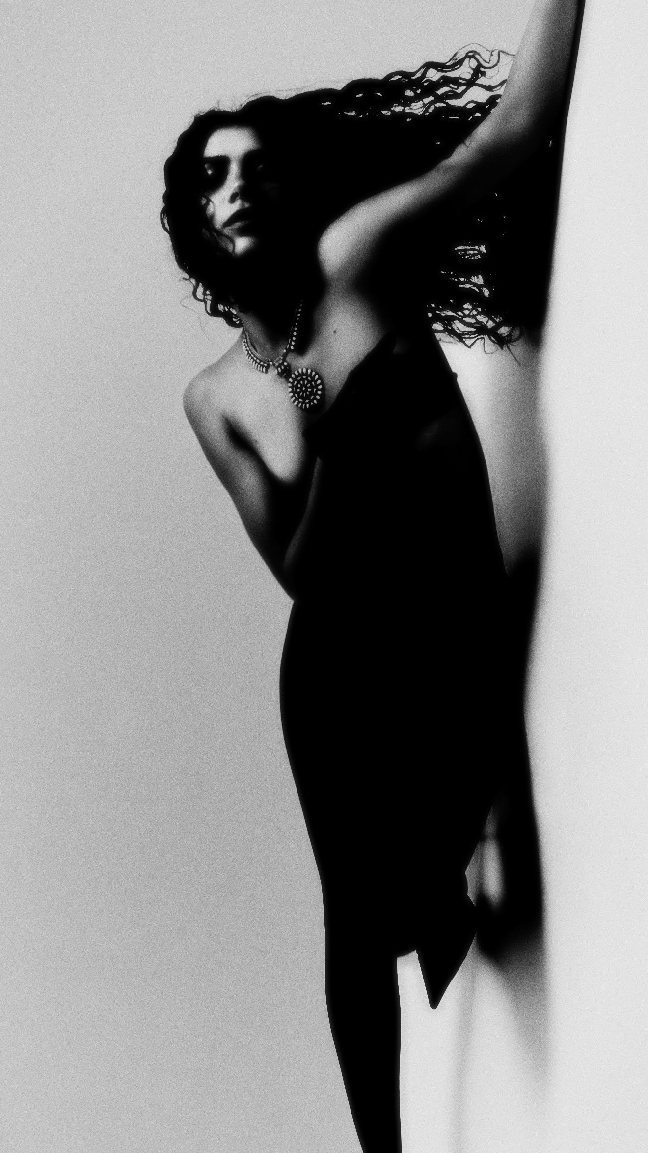 Studio silhouette with raised arms