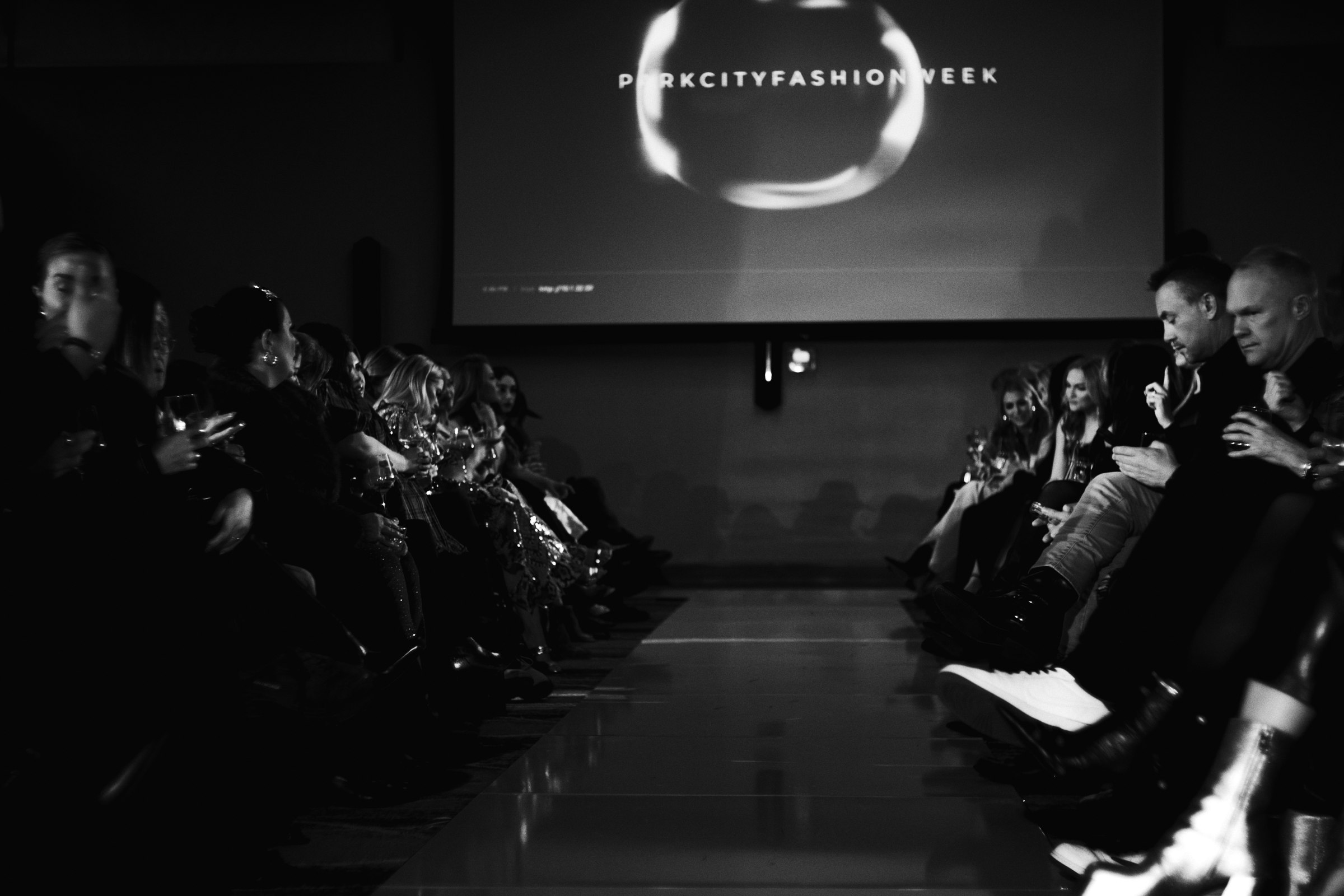 Runway and audience in monochrome