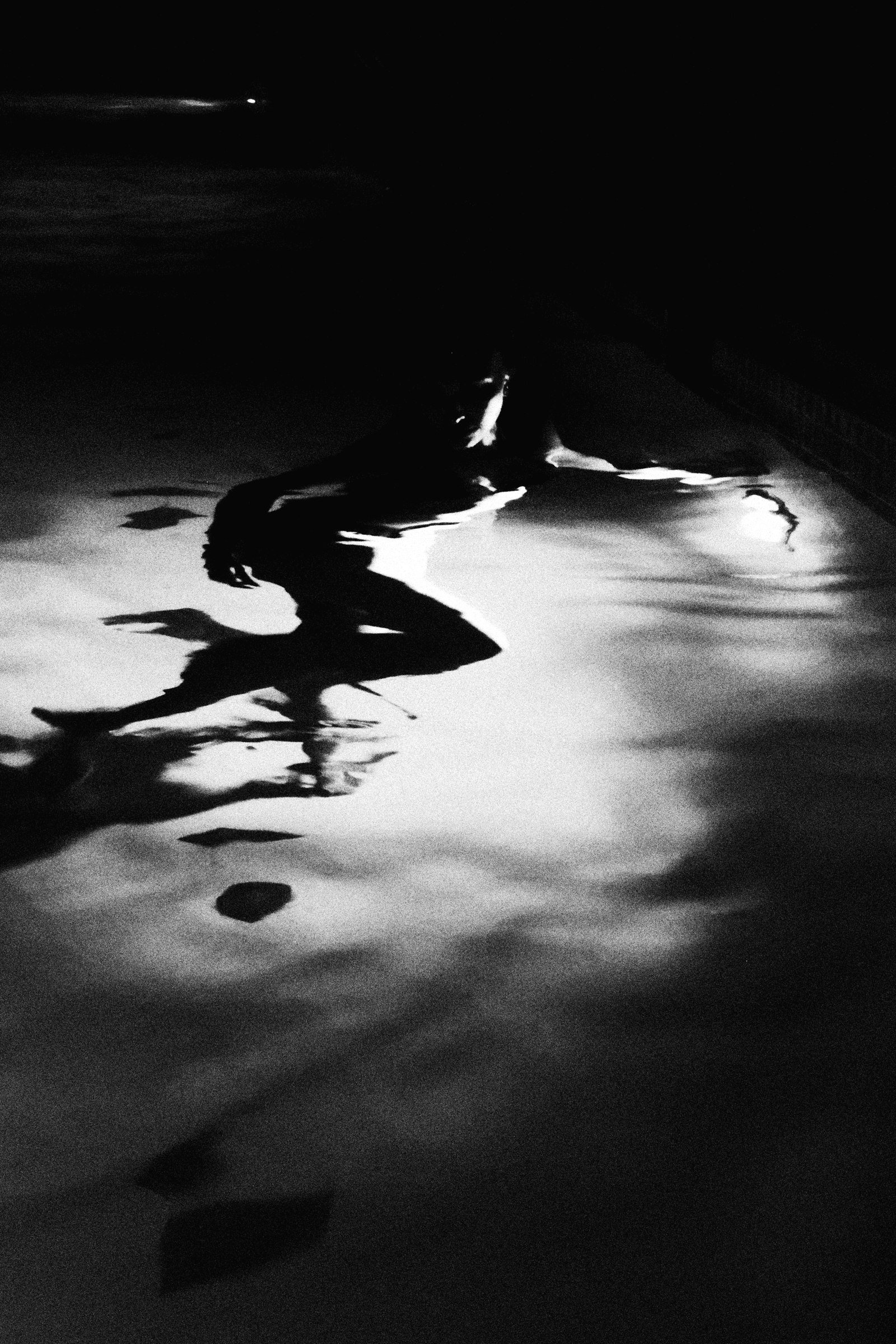 Portrait floating in dark water