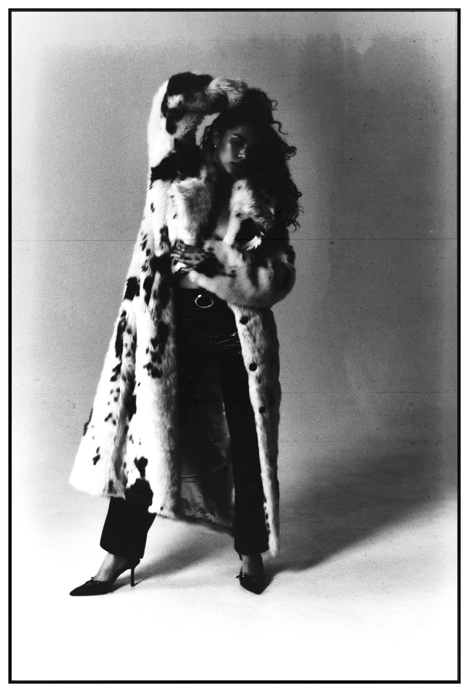 Full-length editorial in a patterned coat