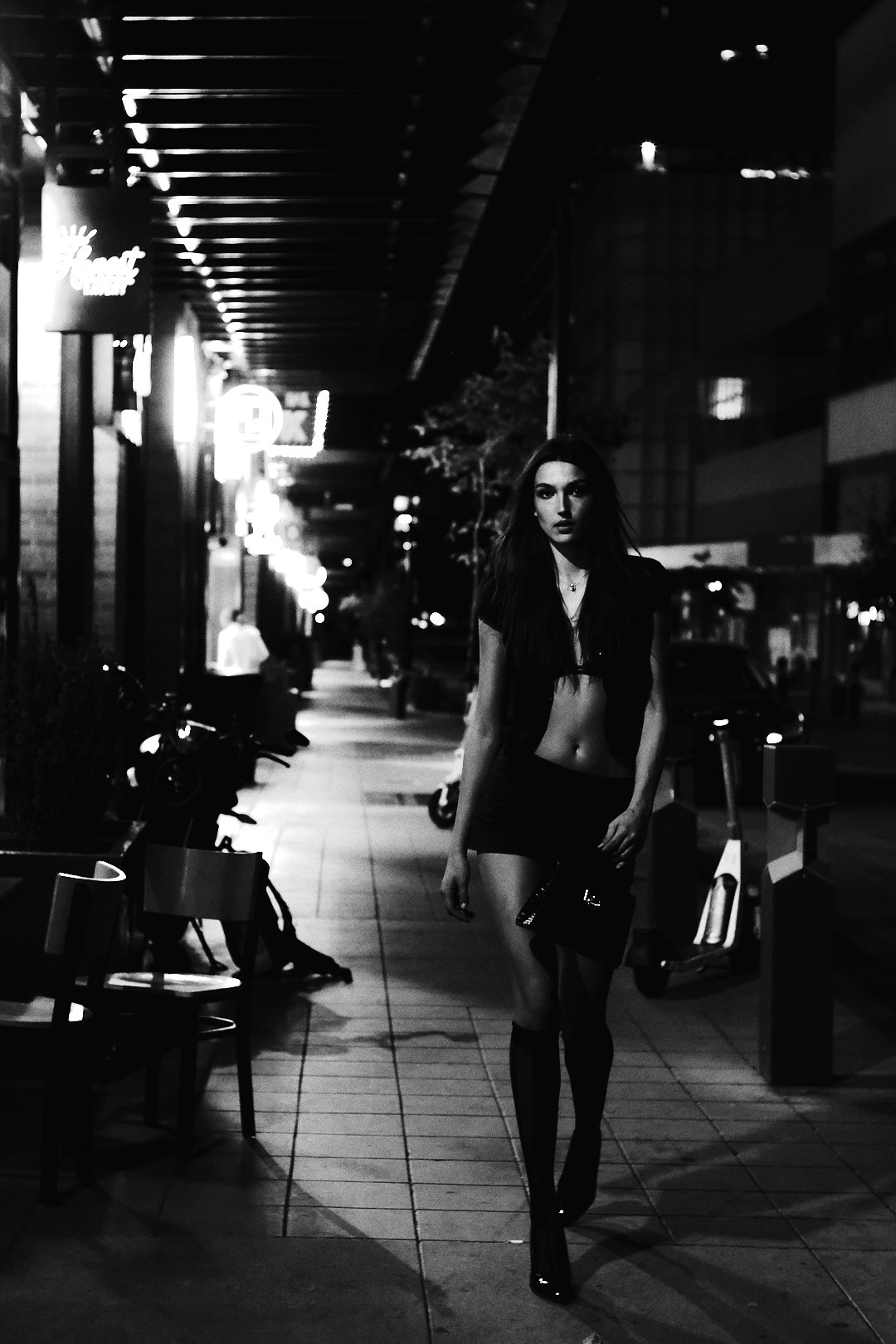 Nighttime fashion editorial on a city sidewalk
