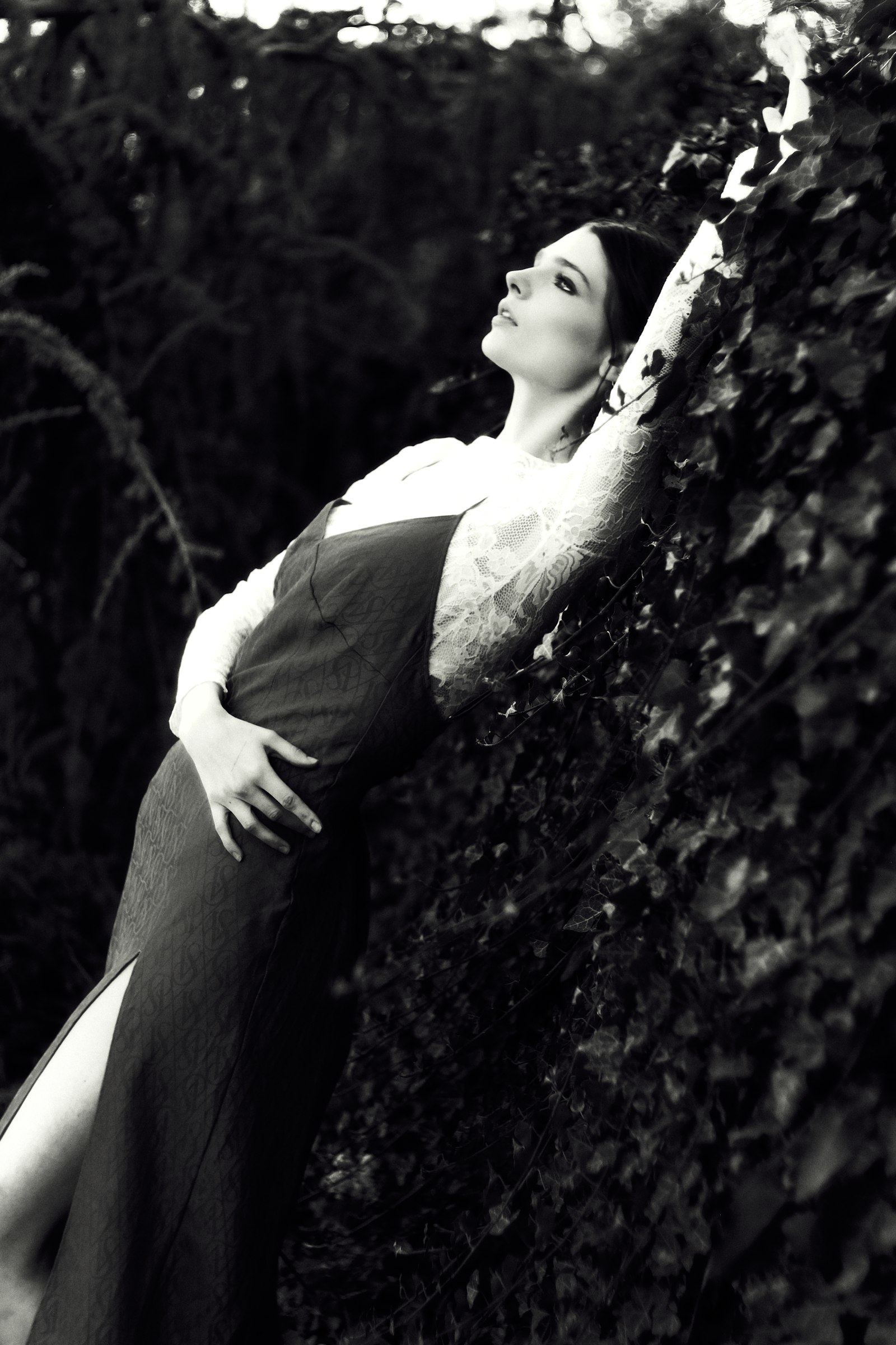 Outdoor portrait leaning against a tree