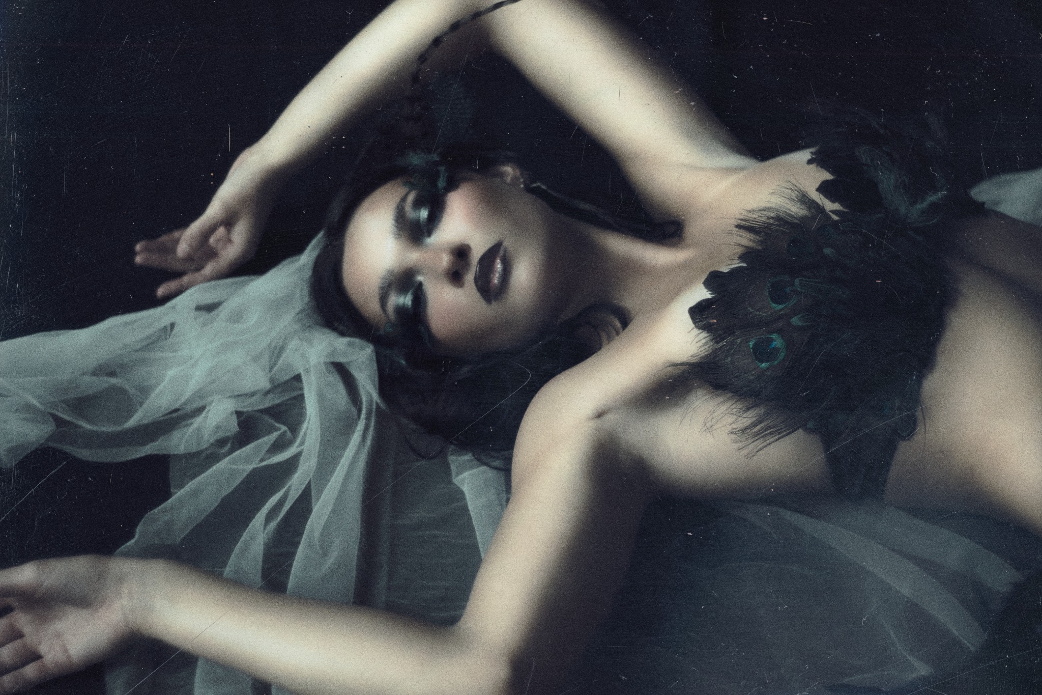 Reclining portrait in muted blue light