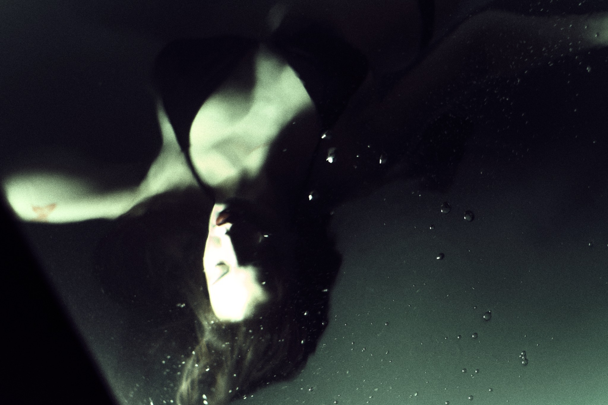 Submerged portrait in green water