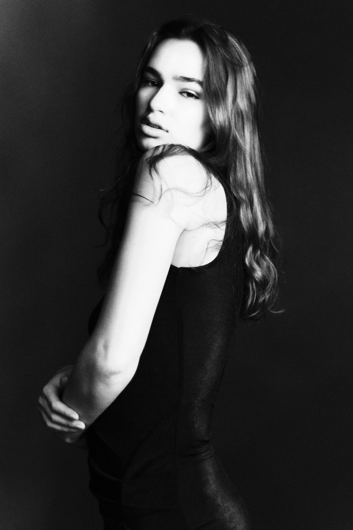 Portrait looking back in a black dress