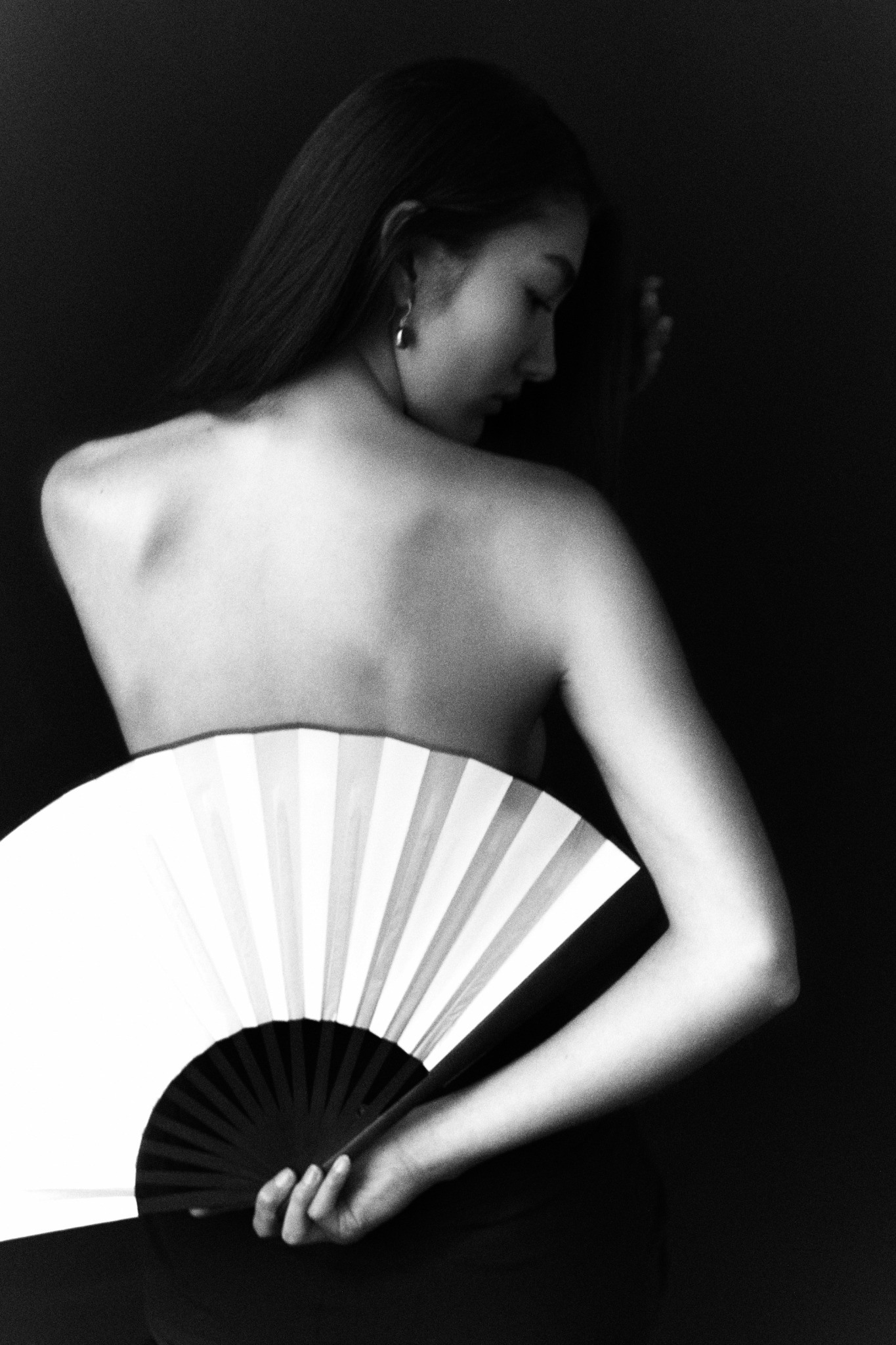 Editorial detail with a folded white fan