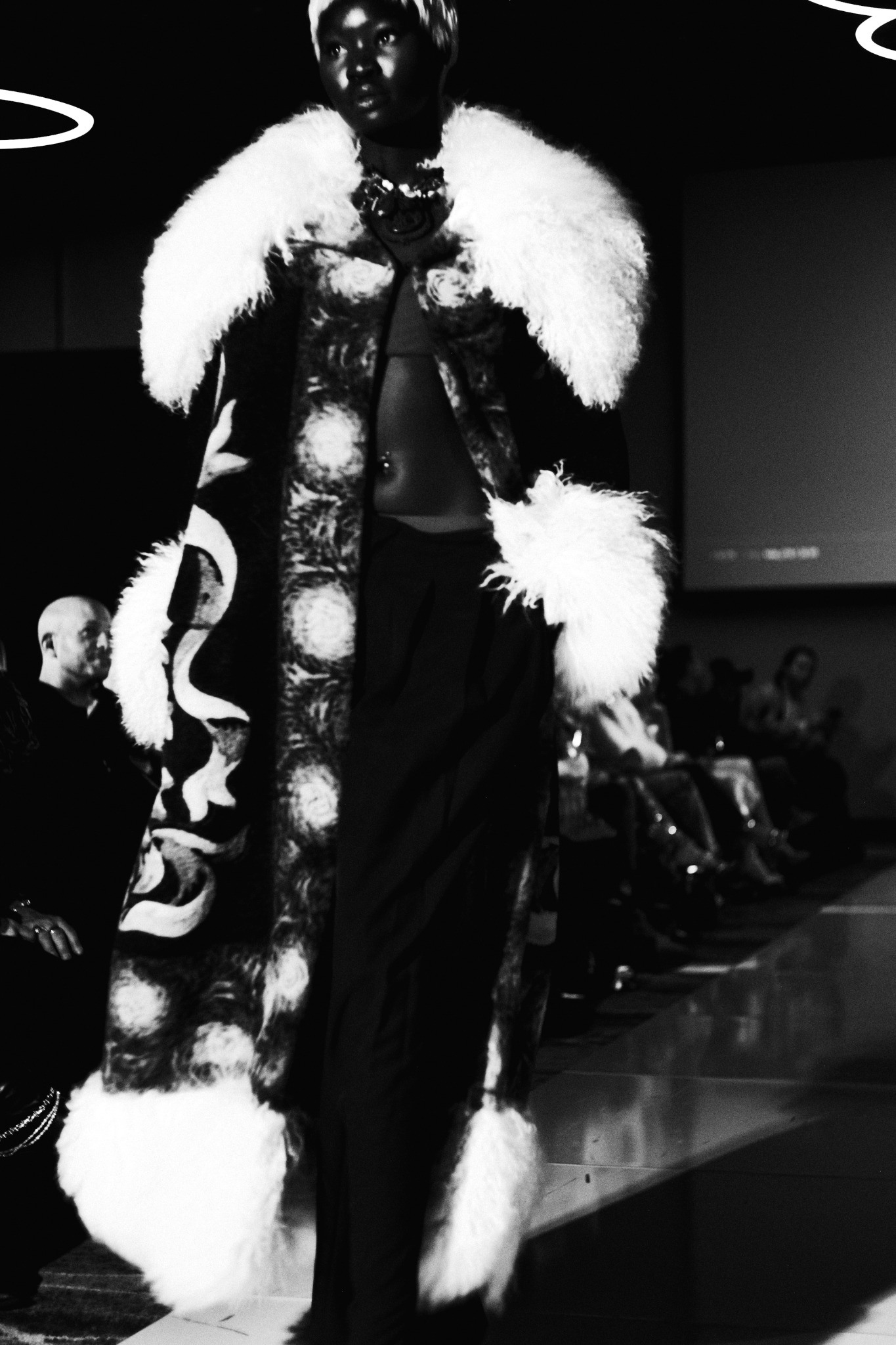 Runway look with sculptural pale fur accents