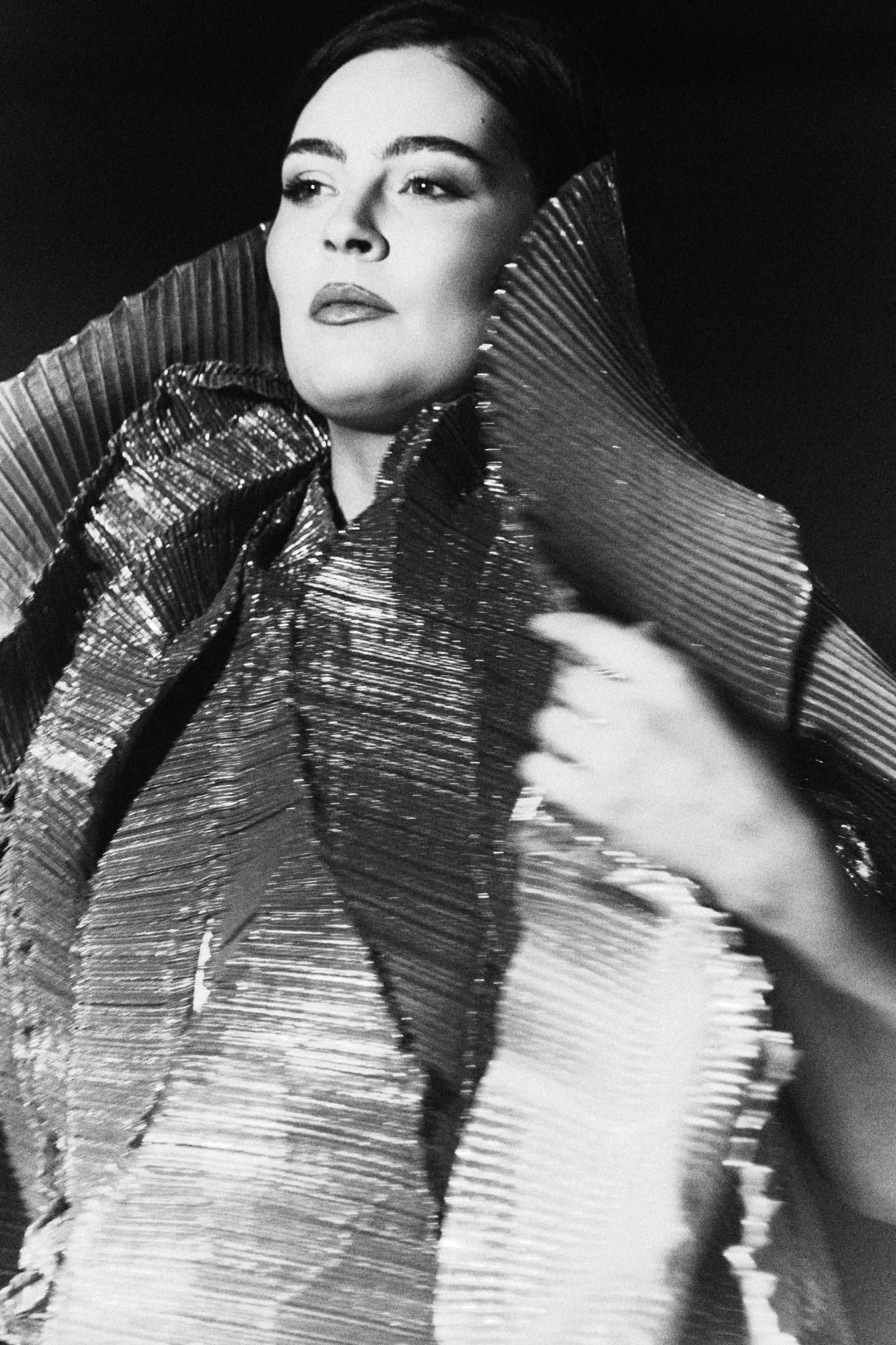 Runway portrait framed by a sculptural collar