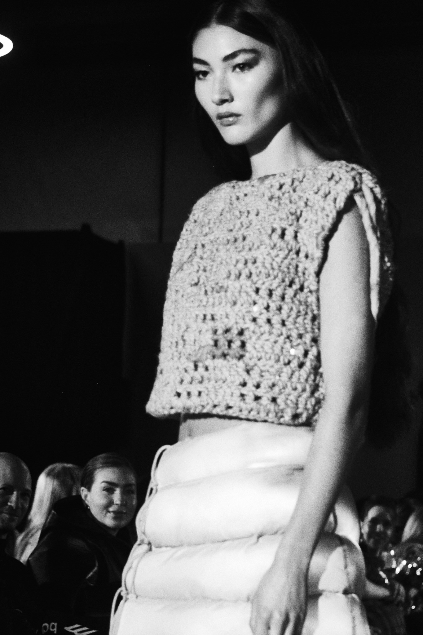 Runway model in a textured cropped top