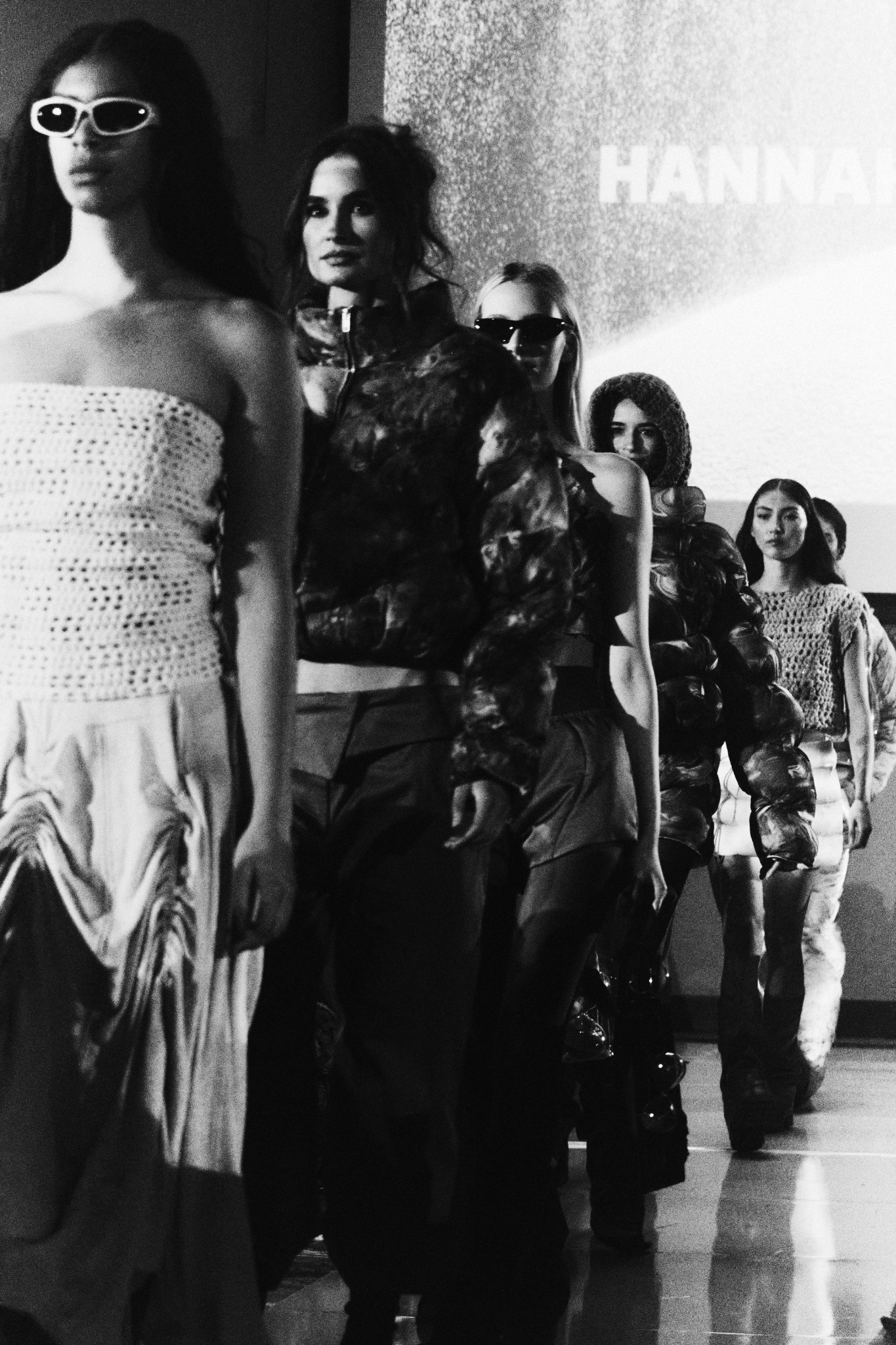 Runway finale with models in textured looks