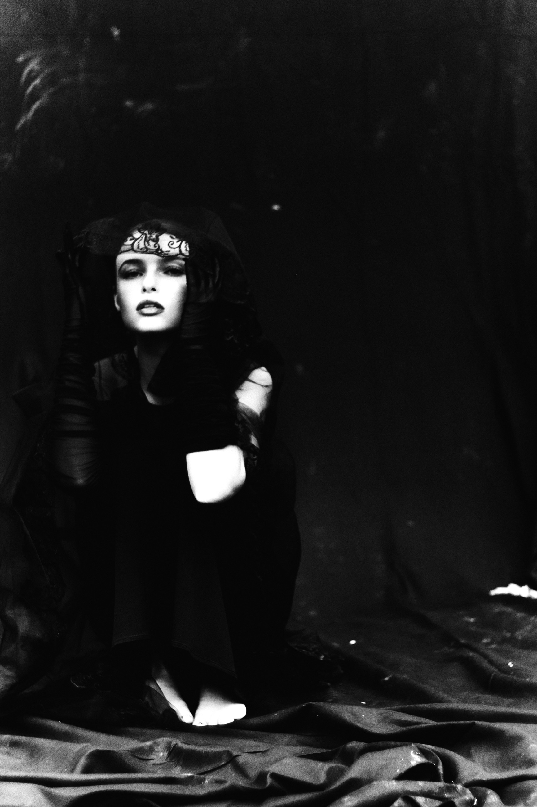 Seated editorial with lace framing the face